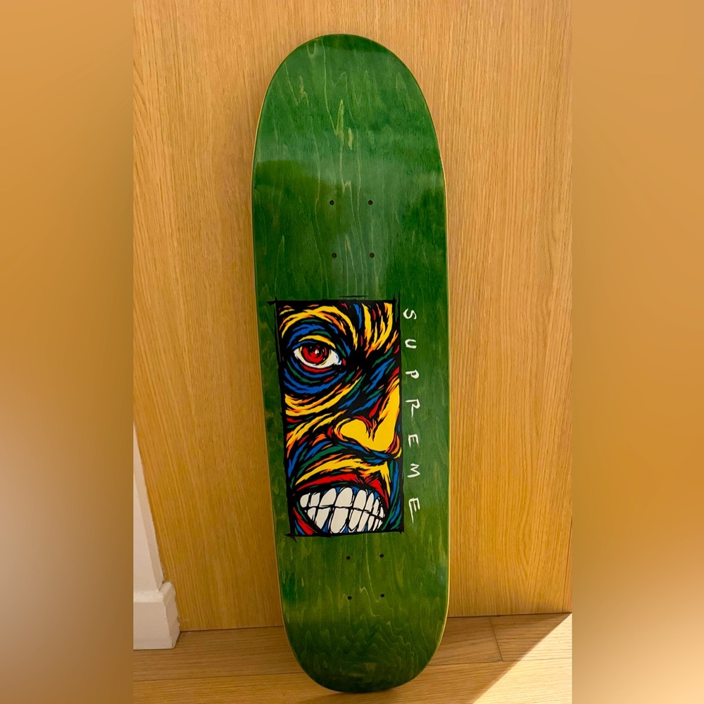 Supreme Green Skateboard Deck with Colorful Face Design